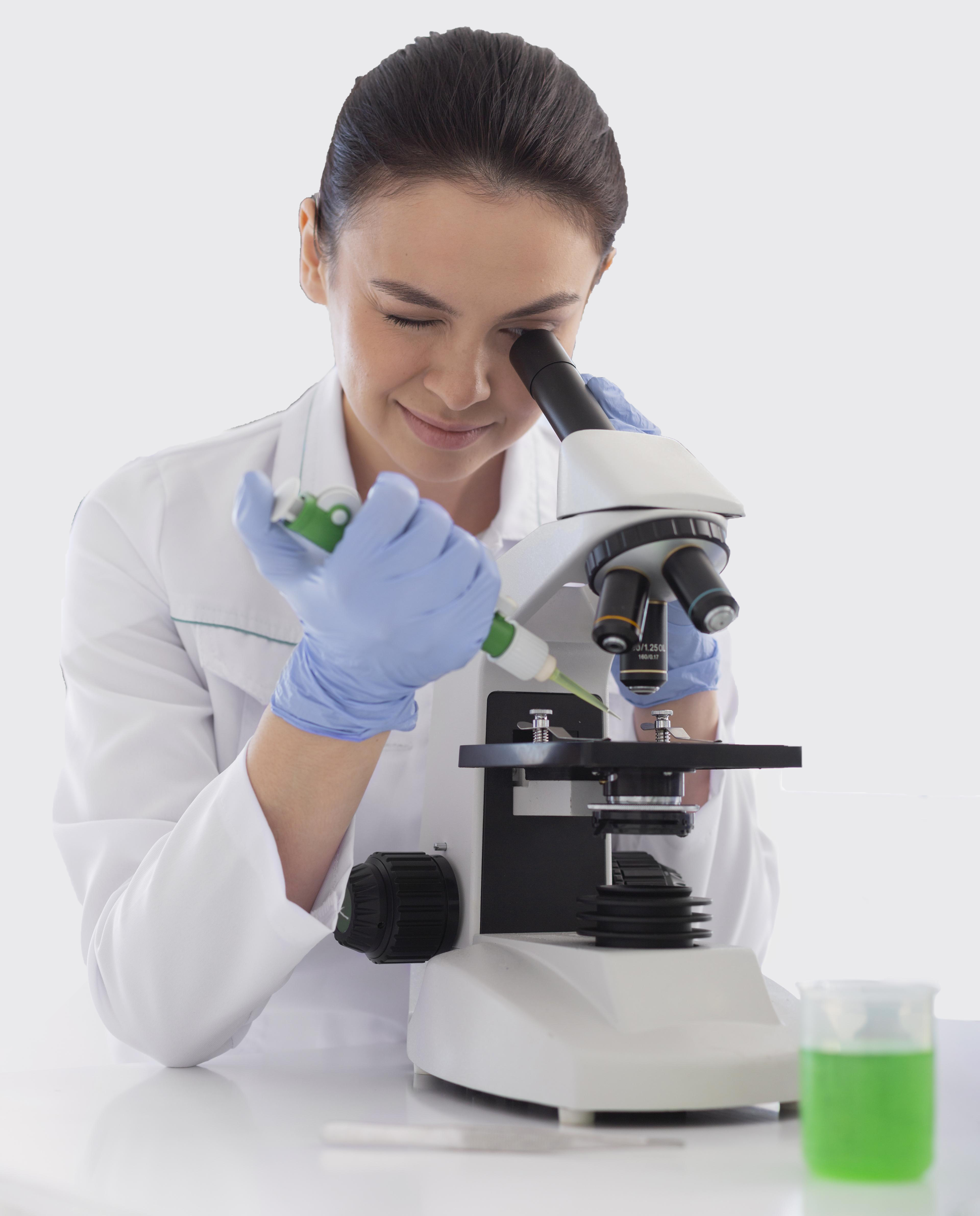 scientist working with microscope medium shotf Home